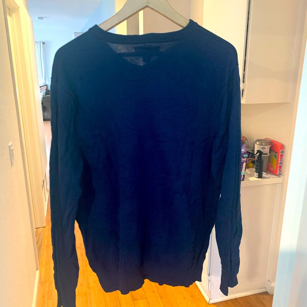 Blue V-neck sweater